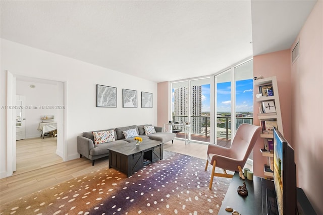 1900 N Bayshore Dr Unit 2514, Miami, FL 33132 - living room featuring wood finished floors and expansive windows