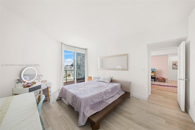 1900 N Bayshore Dr Unit 2514, Miami, FL 33132 - bedroom with light wood-type flooring and baseboards
