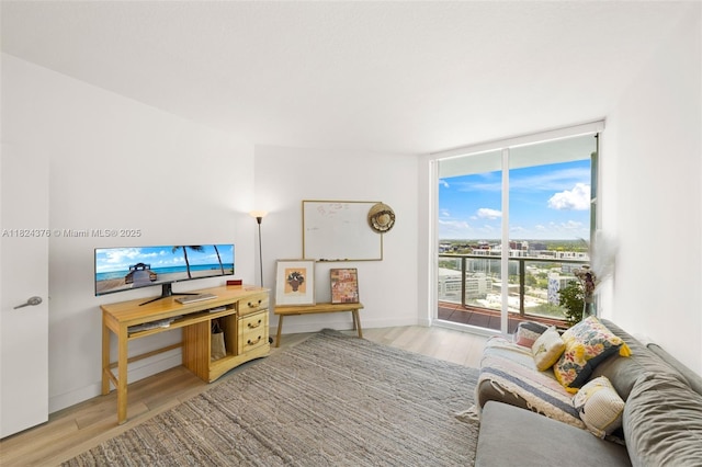 1900 N Bayshore Dr Unit 2514, Miami, FL 33132 - living area with a wall of windows and wood finished floors