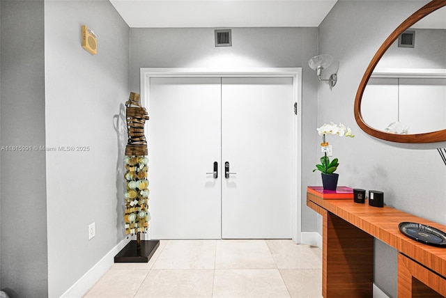 17121 Collins Ave Unit 2304, Sunny Isles Beach, FL 33160 - entryway featuring light tile patterned flooring and baseboards