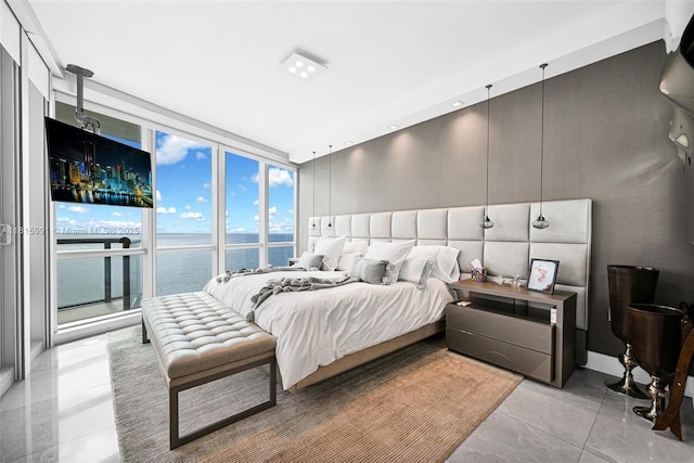 17121 Collins Ave Unit 2304, Sunny Isles Beach, FL 33160 - bedroom featuring a water view and expansive windows