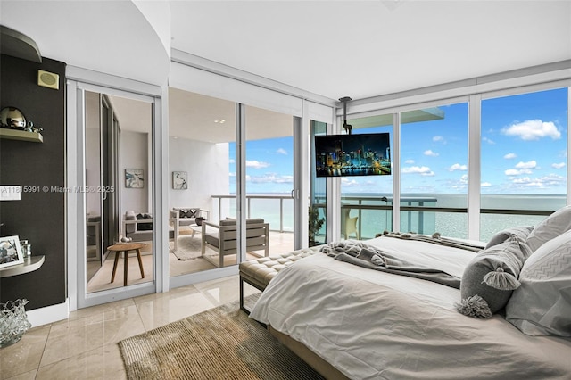 17121 Collins Ave Unit 2304, Sunny Isles Beach, FL 33160 - bedroom featuring a water view, access to outside, and expansive windows