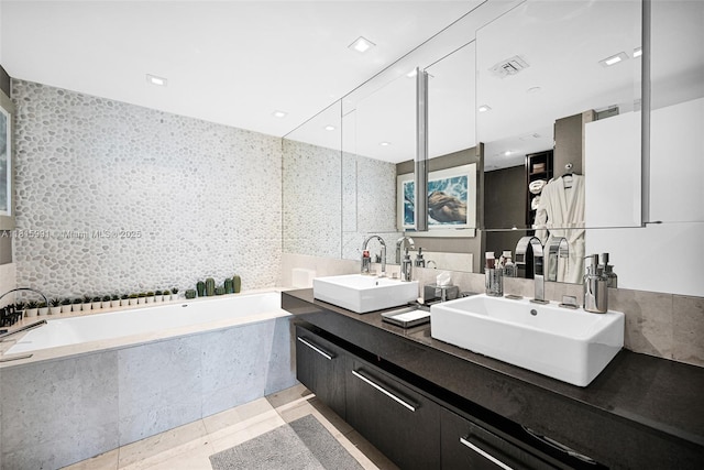 17121 Collins Ave Unit 2304, Sunny Isles Beach, FL 33160 - full bath with double vanity, a bath, and tile patterned flooring