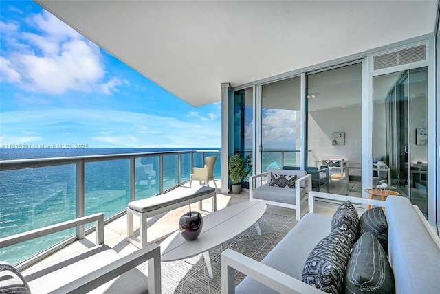 17121 Collins Ave Unit 2304, Sunny Isles Beach, FL 33160 - balcony featuring an outdoor living space and a water view