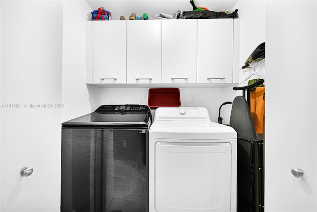 17121 Collins Ave Unit 2304, Sunny Isles Beach, FL 33160 - laundry area featuring cabinet space and washer and dryer