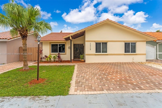 14548 SW 98th Ter, Miami, FL 33186 - ranch-style house with stucco siding and a tile roof