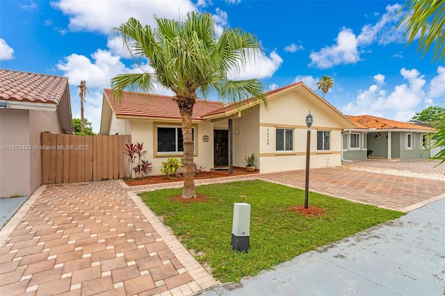 14548 SW 98th Ter, Miami, FL 33186 - ranch-style home with stucco siding, a gate, and a tiled roof