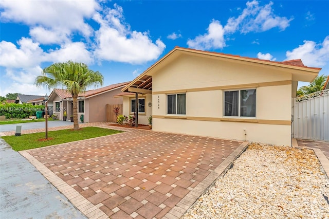 14548 SW 98th Ter, Miami, FL 33186 - rear view of property with stucco siding