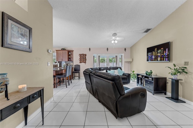 14548 SW 98th Ter, Miami, FL 33186 - living room with a textured ceiling, light tile patterned flooring, and ceiling fan