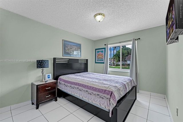 14548 SW 98th Ter, Miami, FL 33186 - bedroom featuring a textured ceiling and light tile patterned floors
