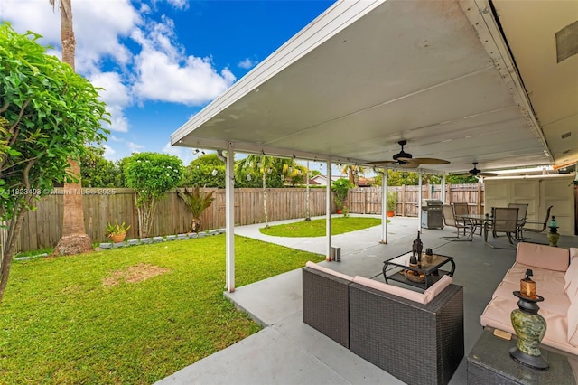 14548 SW 98th Ter, Miami, FL 33186 - fenced backyard featuring a ceiling fan, a patio, outdoor dining area, grilling area, and outdoor lounge area