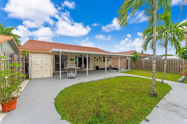 14548 SW 98th Ter, Miami, FL 33186 - back of property with a ceiling fan, a patio area, stucco siding, and a tiled roof