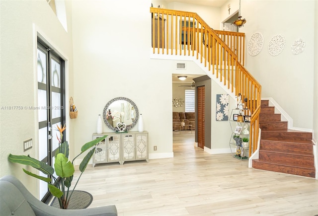 13290 SW 54th Ct, Miramar, FL 33027 - staircase with wood finished floors and a high ceiling