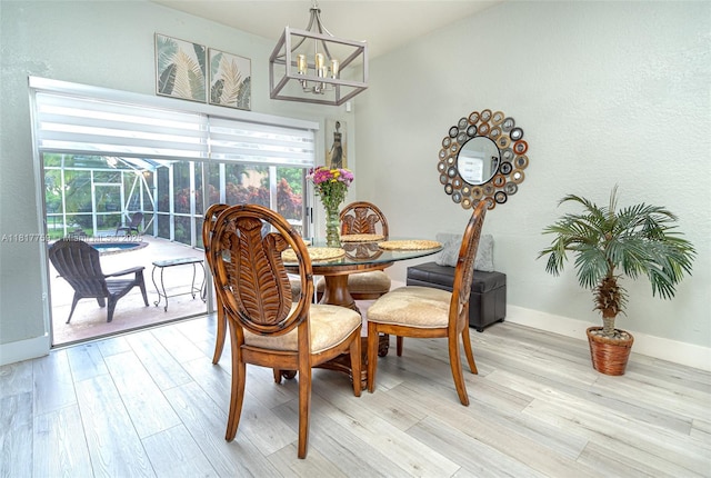13290 SW 54th Ct, Miramar, FL 33027 - dining space with plenty of natural light, light wood-style flooring, and a chandelier