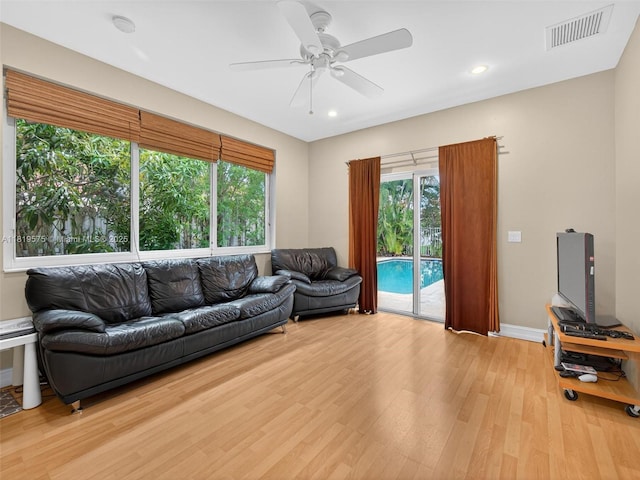 782 Lake Blvd, Weston, FL 33326 - living room featuring light wood-type flooring, ceiling fan, healthy amount of natural light, and recessed lighting