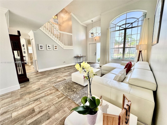 535 SW 181st Way, Pembroke Pines, FL 33029 - living room featuring ornamental molding, wood finished floors, a high ceiling, and stairs