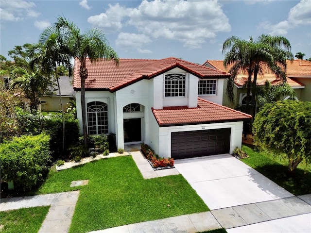 535 SW 181st Way, Pembroke Pines, FL 33029 - mediterranean / spanish home featuring a tiled roof, driveway, stucco siding, a front lawn, and an attached garage