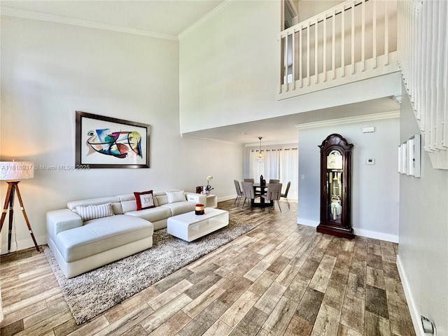 535 SW 181st Way, Pembroke Pines, FL 33029 - living area featuring wood finished floors, crown molding, and a towering ceiling