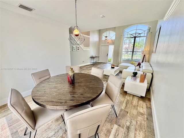 535 SW 181st Way, Pembroke Pines, FL 33029 - dining area featuring light wood finished floors and crown molding