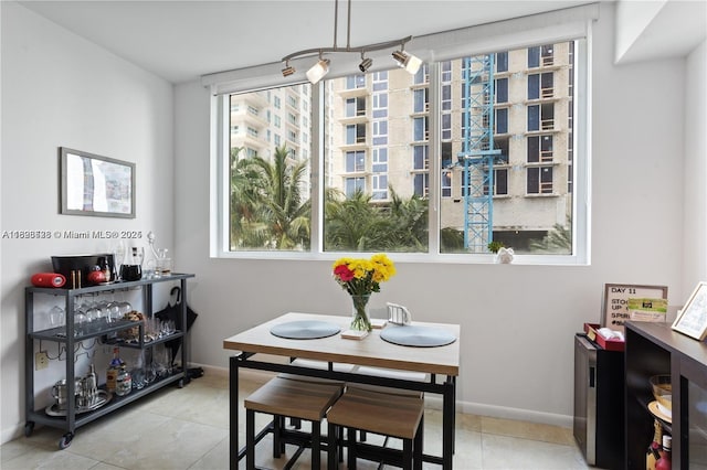 253 NE 2nd St Unit 1108, Miami, FL 33132 - dining area with tile patterned flooring and baseboards