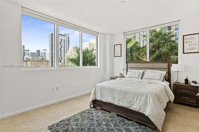 253 NE 2nd St Unit 1108, Miami, FL 33132 - bedroom with light tile patterned floors, multiple windows, and a city view
