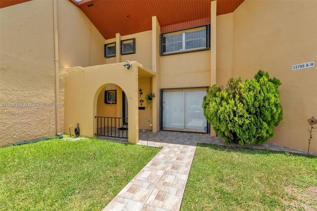 13705 SW 84th St Unit H, Miami, FL 33183 - property entrance featuring stucco siding and a yard