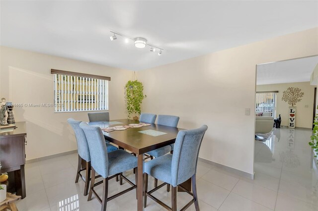 13705 SW 84th St Unit H, Miami, FL 33183 - dining space featuring baseboards and light tile patterned flooring