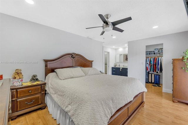 13705 SW 84th St Unit H, Miami, FL 33183 - bedroom featuring a spacious closet, light wood-style flooring, a closet, recessed lighting, and ensuite bathroom