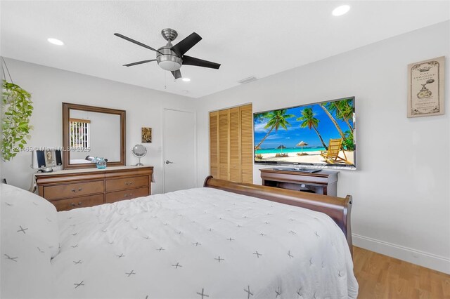 13705 SW 84th St Unit H, Miami, FL 33183 - bedroom with wood finished floors, recessed lighting, a closet, and a ceiling fan