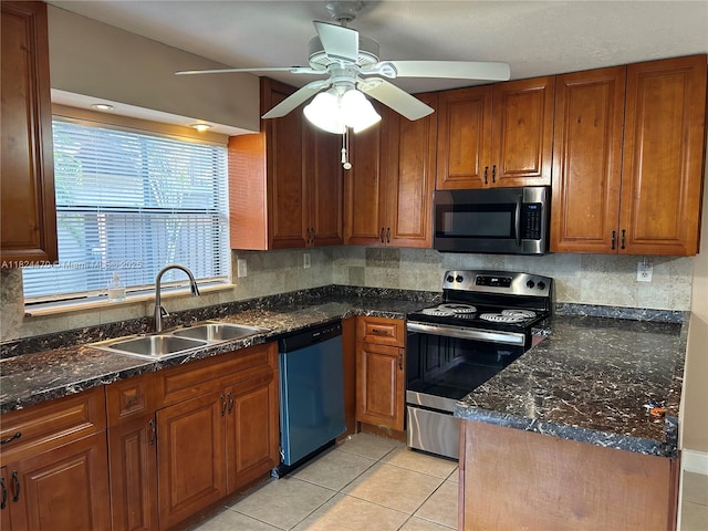 5818 Swordfish Ct Unit D, Tamarac, FL 33319 - kitchen with appliances with stainless steel finishes, ceiling fan, backsplash, and brown cabinets