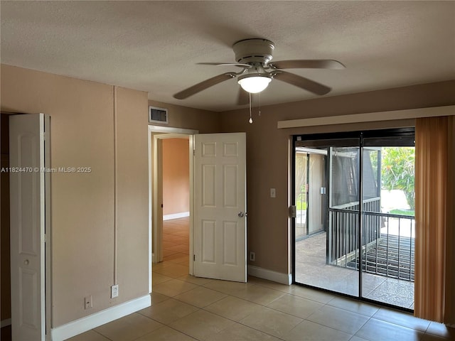 5818 Swordfish Ct Unit D, Tamarac, FL 33319 - unfurnished room featuring a ceiling fan, a textured ceiling, and light tile patterned floors
