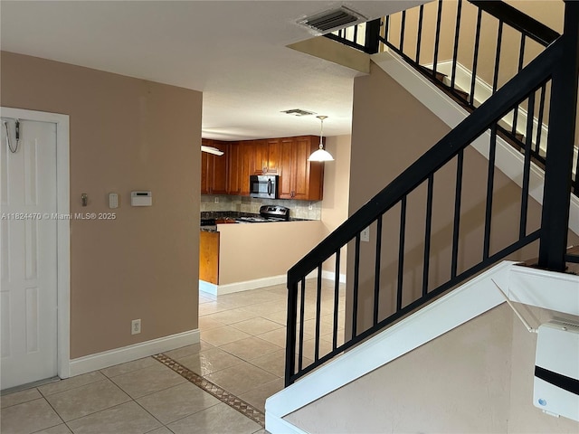 5818 Swordfish Ct Unit D, Tamarac, FL 33319 - stairs with tile patterned floors and baseboards