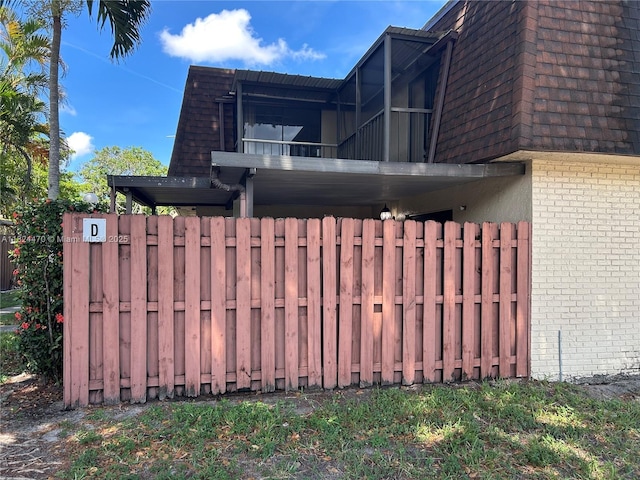 5818 Swordfish Ct Unit D, Tamarac, FL 33319 - view of property exterior with brick siding and mansard roof