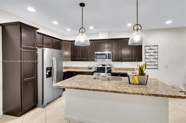8144 Cascada Isles Dr, Cooper City, FL 33024 - kitchen featuring appliances with stainless steel finishes, light tile patterned flooring, dark brown cabinetry, light stone counters, and recessed lighting