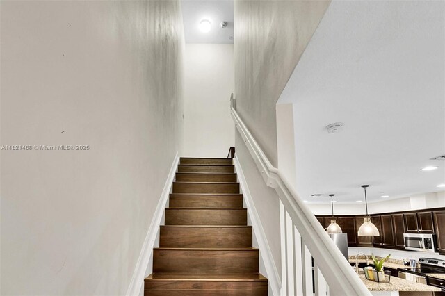 8144 Cascada Isles Dr, Cooper City, FL 33024 - stairs featuring recessed lighting