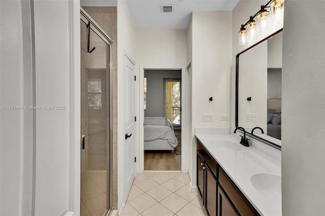 8144 Cascada Isles Dr, Cooper City, FL 33024 - ensuite bathroom with tile patterned floors, double vanity, and a shower stall