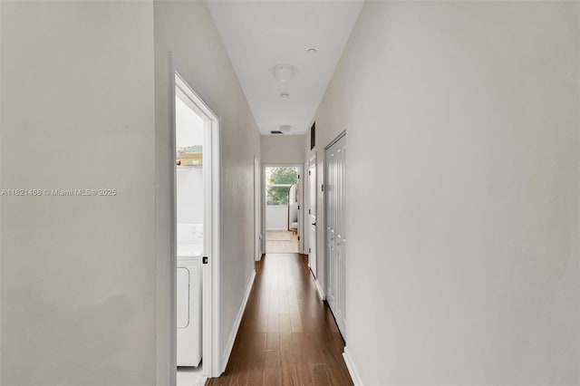8144 Cascada Isles Dr, Cooper City, FL 33024 - corridor with washer / clothes dryer and dark wood-type flooring