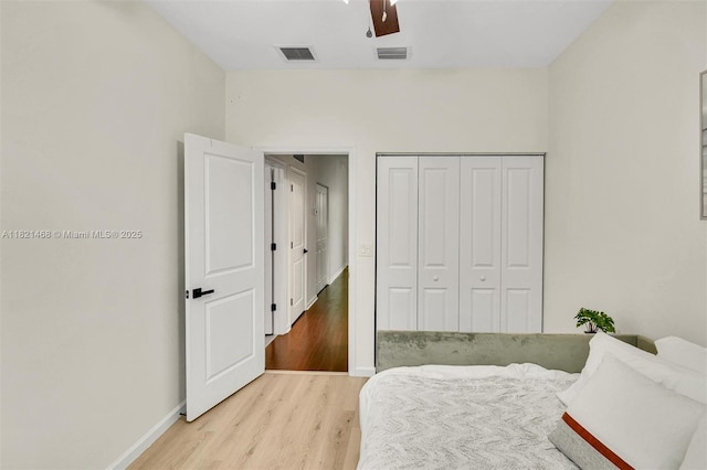 8144 Cascada Isles Dr, Cooper City, FL 33024 - bedroom featuring wood finished floors, a closet, and ceiling fan