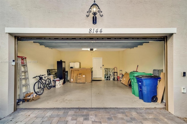8144 Cascada Isles Dr, Cooper City, FL 33024 - garage featuring a garage door opener