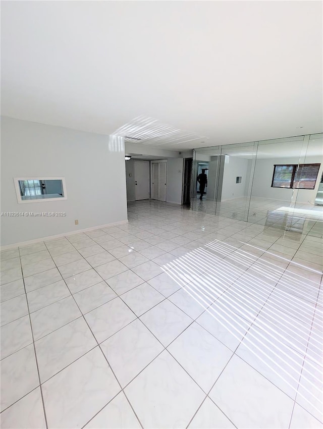 14901 SW 4th St Unit 9A, Pembroke Pines, FL 33027 - unfurnished living room with tile patterned flooring