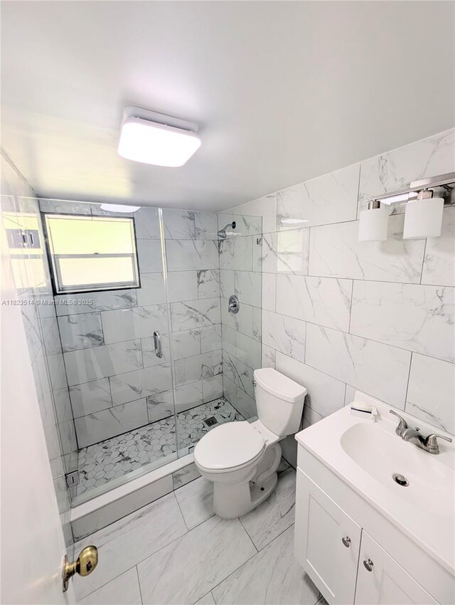 14901 SW 4th St Unit 9A, Pembroke Pines, FL 33027 - full bath with a shower stall, vanity, marble look tiles, and tile walls