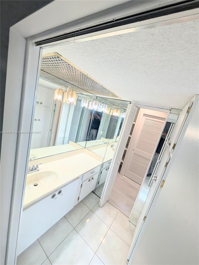 14901 SW 4th St Unit 9A, Pembroke Pines, FL 33027 - bathroom featuring vanity and tile patterned flooring