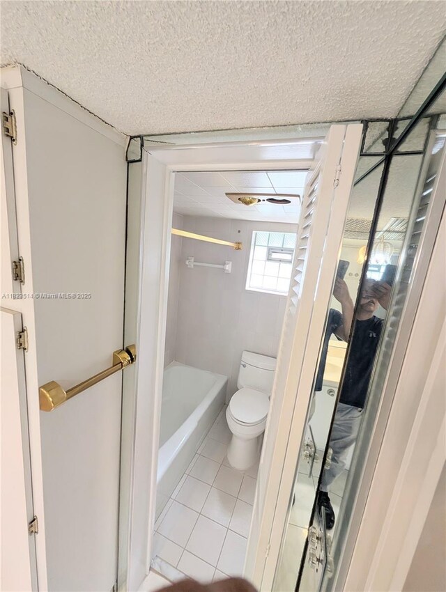 14901 SW 4th St Unit 9A, Pembroke Pines, FL 33027 - bathroom with tile patterned flooring and a textured ceiling