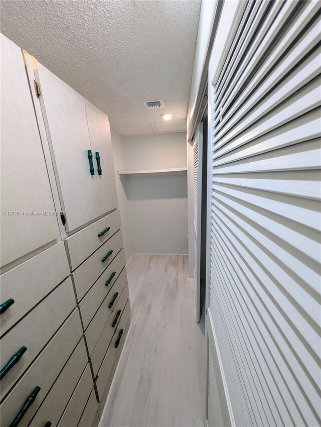 14901 SW 4th St Unit 9A, Pembroke Pines, FL 33027 - walk in closet with light wood finished floors