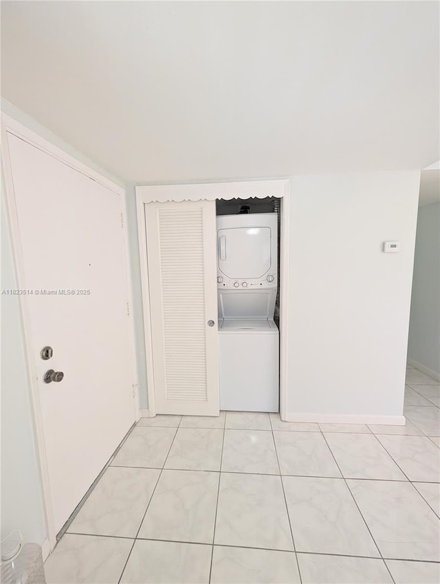14901 SW 4th St Unit 9A, Pembroke Pines, FL 33027 - corridor with stacked washing machine and dryer and baseboards