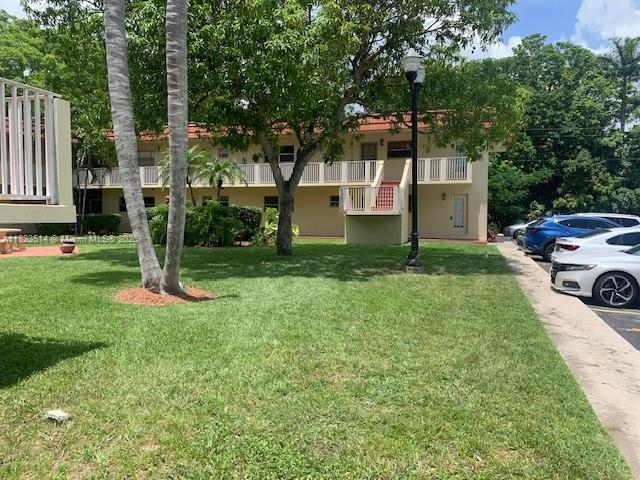 14901 SW 4th St Unit 9A, Pembroke Pines, FL 33027 - view of green lawn