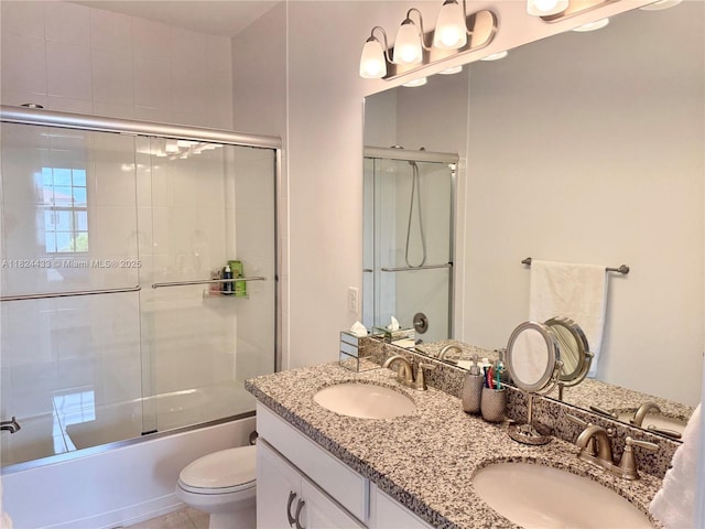 11455 Solstice Cir, Parkland, FL 33076 - bathroom featuring double vanity and bath / shower combo with glass door