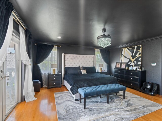 1851 SW 126th Ct, Miami, FL 33175 - bedroom with wood finished floors, ornamental molding, and a chandelier