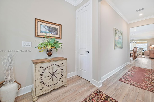 42250 Ramble Rd, Punta Gorda, FL 33982 - hall with crown molding, light wood-style floors, a chandelier, and recessed lighting