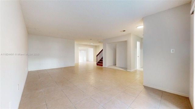 14263 SW 97th Ter, Miami, FL 33186 - unfurnished room featuring stairs, light tile patterned floors, and recessed lighting